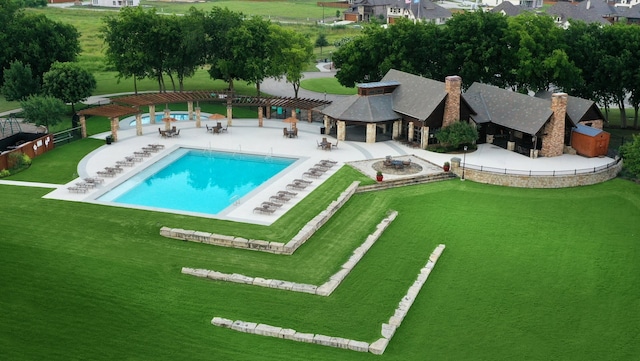 view of swimming pool with a patio area, a lawn, and a pergola