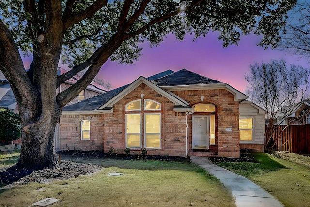 ranch-style house with a lawn