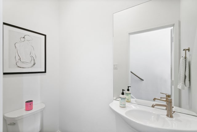 bathroom with sink and toilet