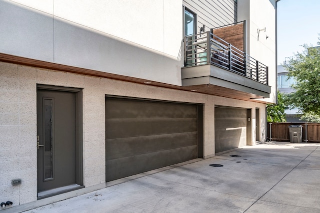 view of side of home with a garage