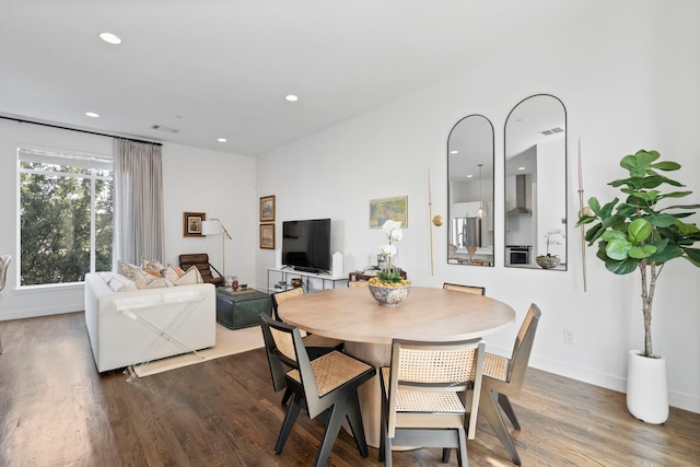 dining space featuring dark hardwood / wood-style floors