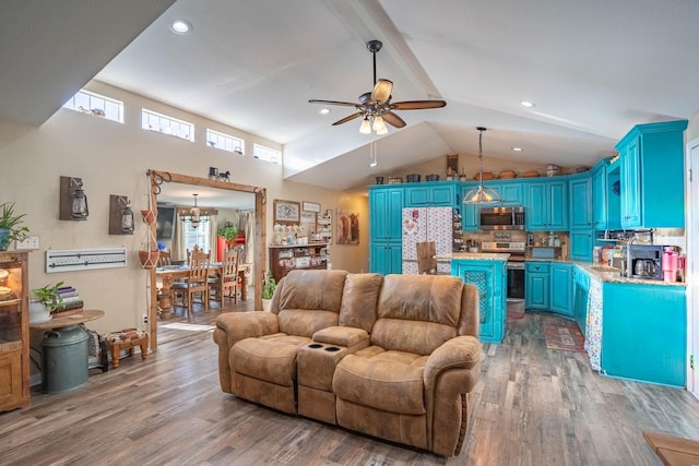 living room featuring hardwood / wood-style flooring, plenty of natural light, and vaulted ceiling