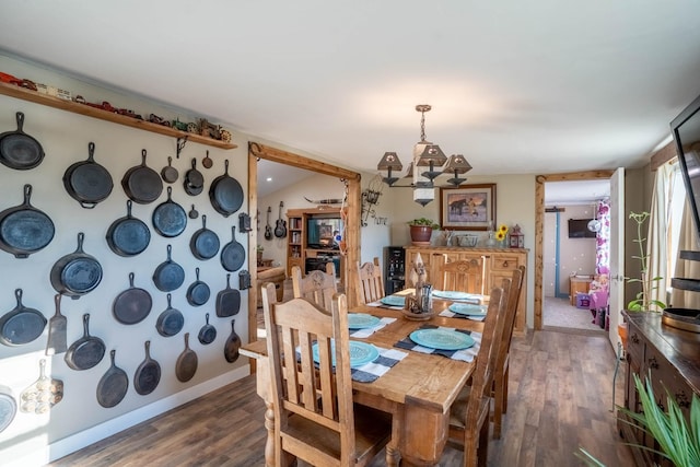 dining area featuring dark wood-type flooring