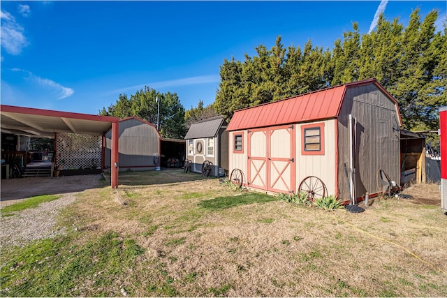 exterior space with a shed and a carport