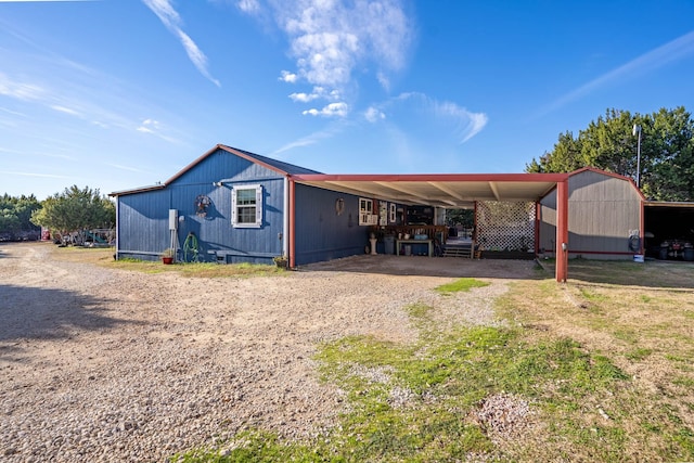 exterior space with a carport