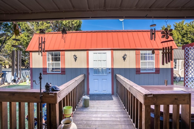 property entrance with a wooden deck