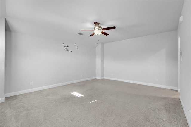 unfurnished room featuring ceiling fan and light carpet