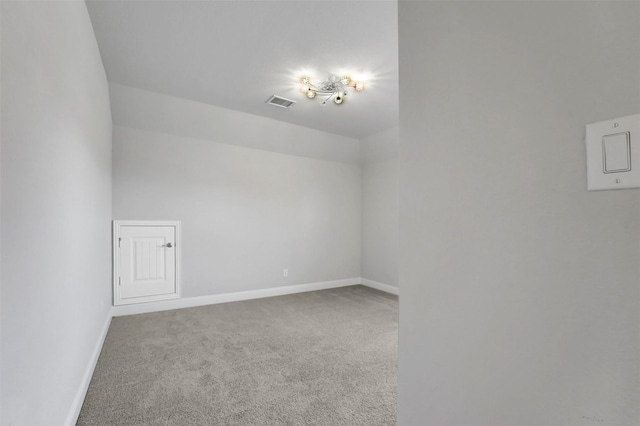 additional living space featuring carpet floors and lofted ceiling