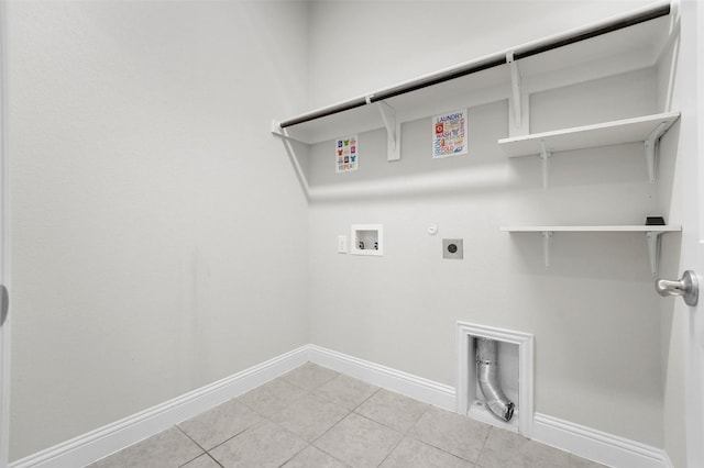 laundry area featuring hookup for a washing machine, hookup for an electric dryer, hookup for a gas dryer, and light tile patterned floors