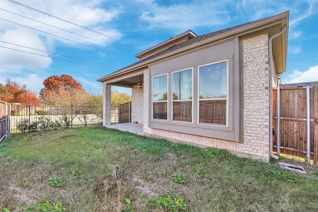 view of side of home featuring a yard