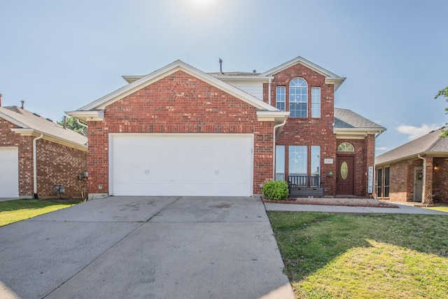 view of front property with a front lawn and a garage