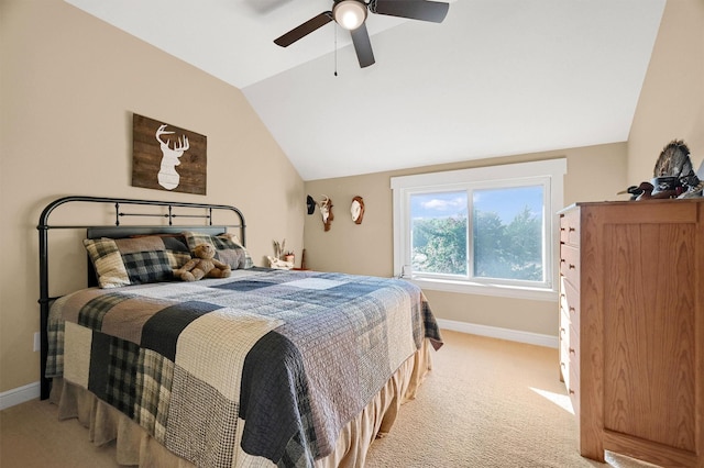 carpeted bedroom featuring vaulted ceiling and ceiling fan