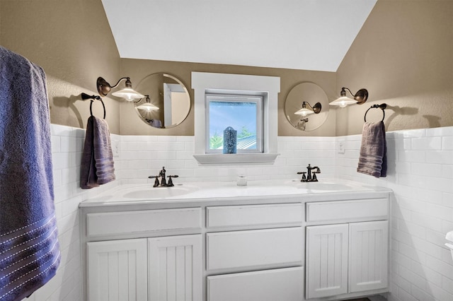 bathroom featuring vanity and vaulted ceiling