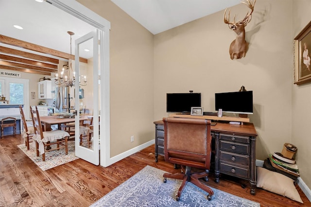 office featuring french doors, dark hardwood / wood-style flooring, a notable chandelier, and beam ceiling