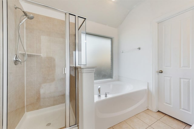 bathroom featuring vaulted ceiling, tile patterned flooring, and plus walk in shower