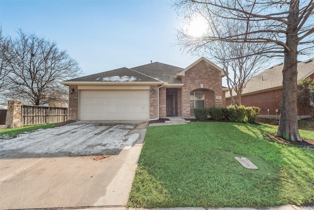 single story home with a garage and a front lawn