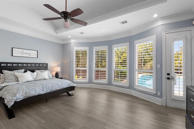 bedroom with ceiling fan, access to exterior, multiple windows, and ornamental molding