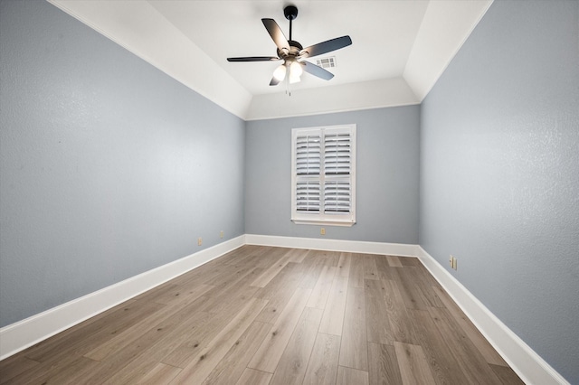 unfurnished room featuring ceiling fan, light hardwood / wood-style floors, and lofted ceiling