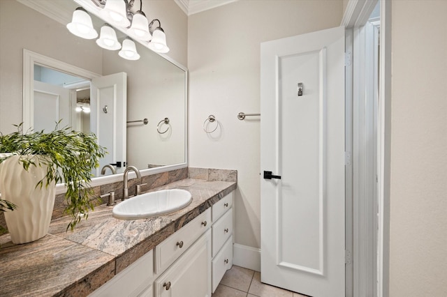 bathroom with tile patterned floors, vanity, and ornamental molding