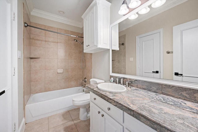 full bathroom featuring tiled shower / bath, tile patterned flooring, vanity, toilet, and ornamental molding