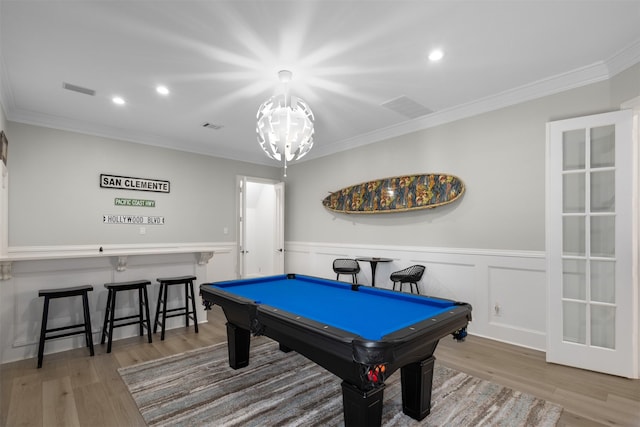 game room with crown molding, hardwood / wood-style flooring, and billiards