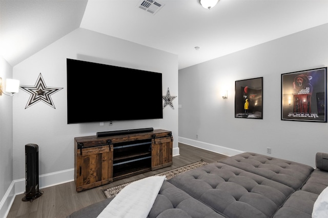 living room with vaulted ceiling and dark hardwood / wood-style flooring