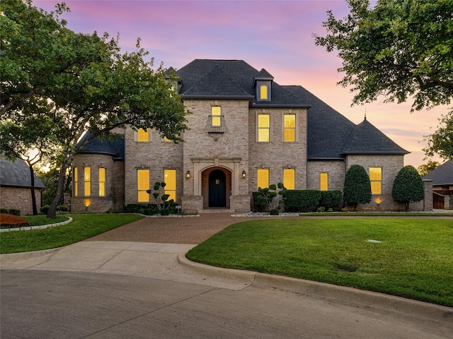 view of front of house with a lawn