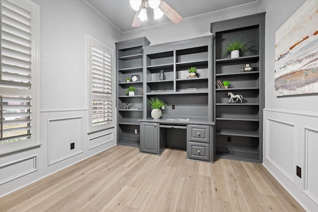 office featuring crown molding, a healthy amount of sunlight, light hardwood / wood-style flooring, and ceiling fan