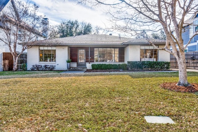 ranch-style house with a front yard