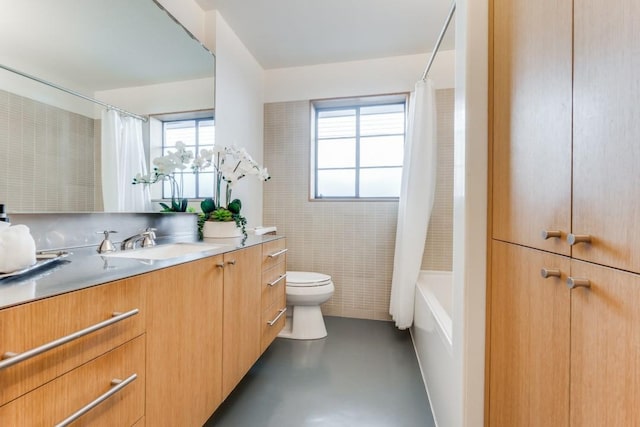 full bathroom featuring toilet, vanity, concrete floors, and shower / bath combination with curtain