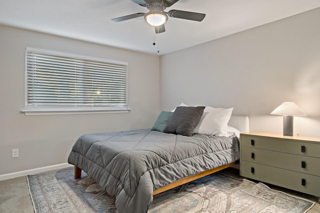 bedroom with ceiling fan and carpet flooring