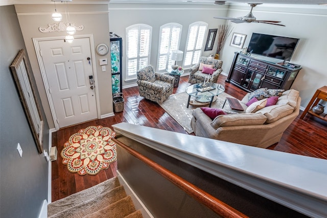 living room featuring ceiling fan and wood-type flooring