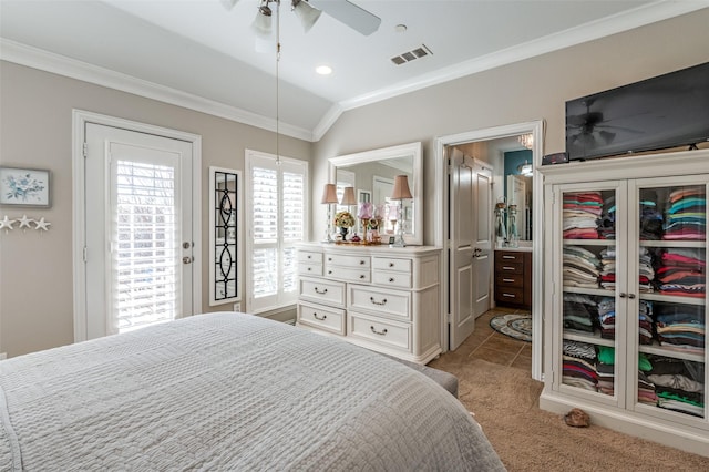 bedroom with ensuite bath, vaulted ceiling, ceiling fan, ornamental molding, and light carpet