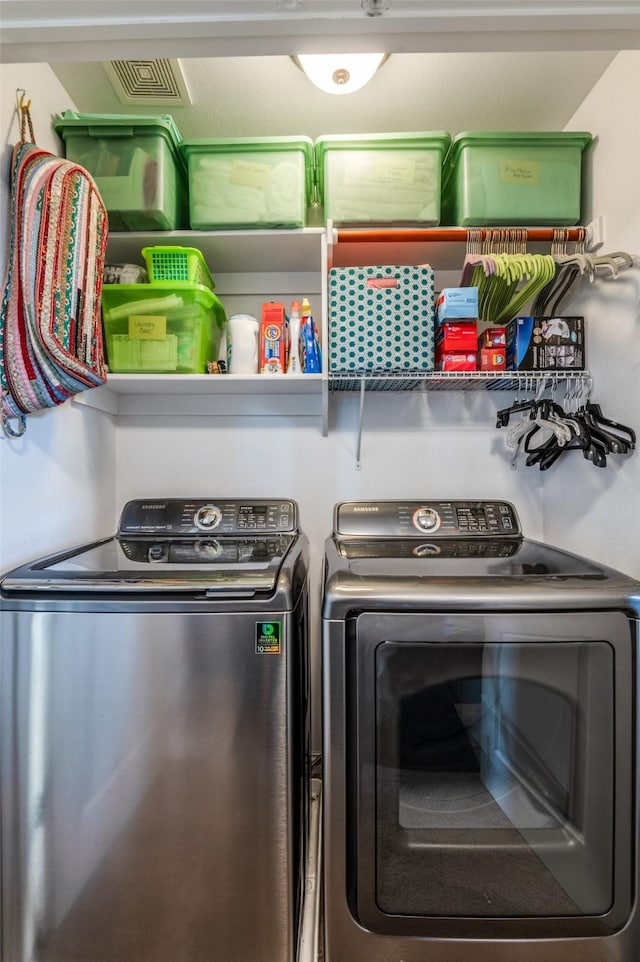 laundry room with washer and dryer