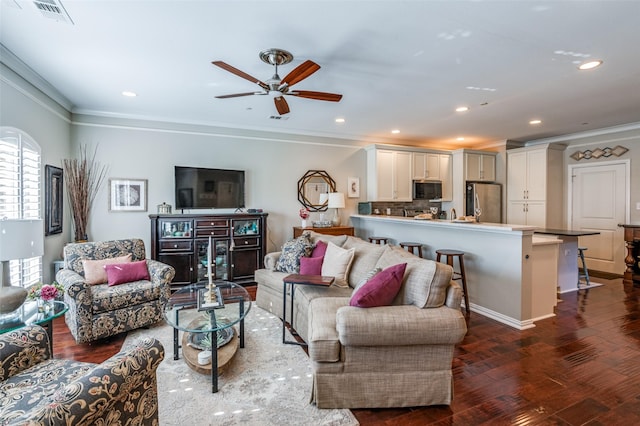 living room featuring ceiling fan, dark hardwood / wood-style flooring, and crown molding