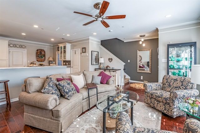 living room featuring ceiling fan, ornamental molding, and dark hardwood / wood-style floors