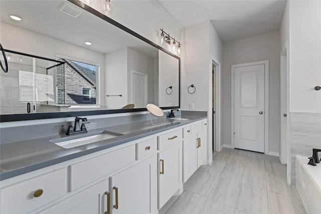 bathroom featuring plus walk in shower and vanity