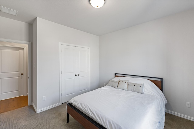 bedroom featuring a closet and carpet