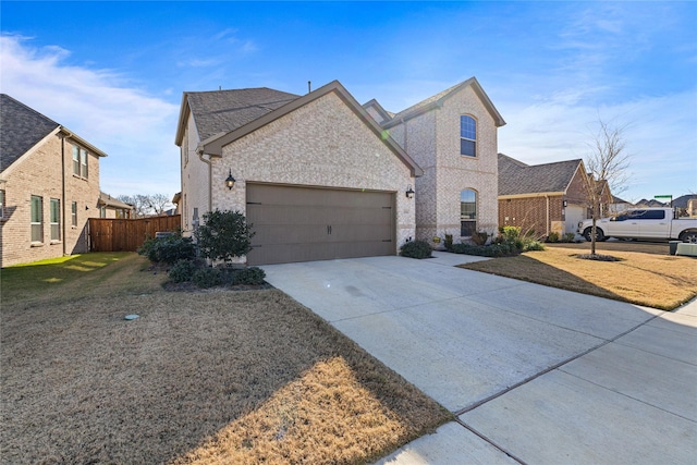 view of front of house featuring a front yard and a garage