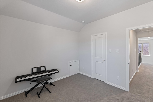 misc room featuring lofted ceiling and carpet