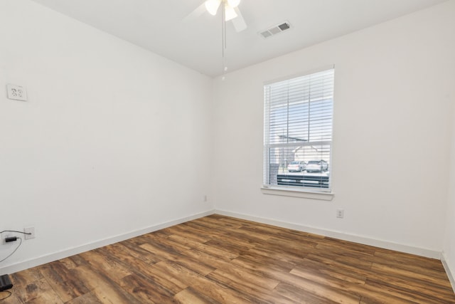 empty room with hardwood / wood-style flooring and ceiling fan