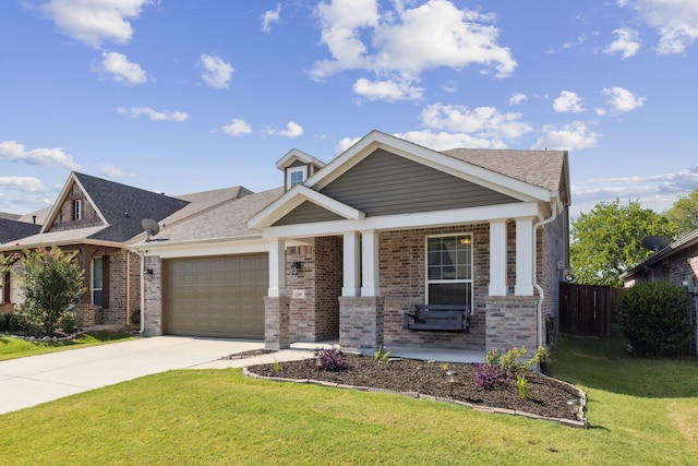 craftsman inspired home with a front lawn, a porch, and a garage