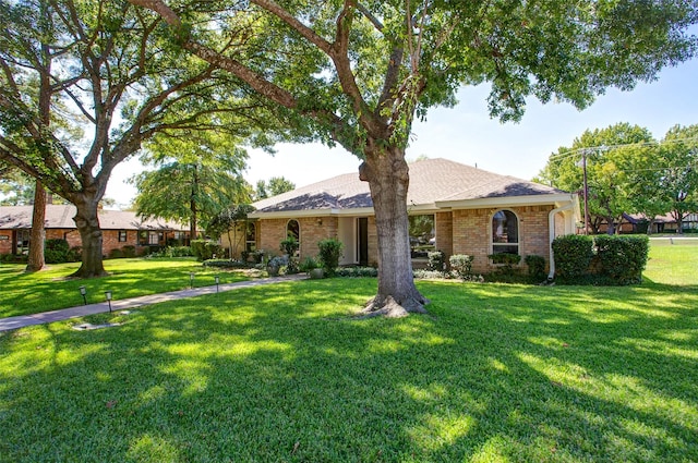 ranch-style home with a front yard