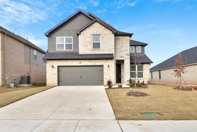 view of front of house with a front yard, a garage, and cooling unit