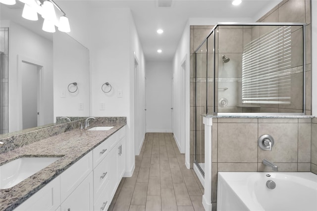 bathroom with vanity and plus walk in shower