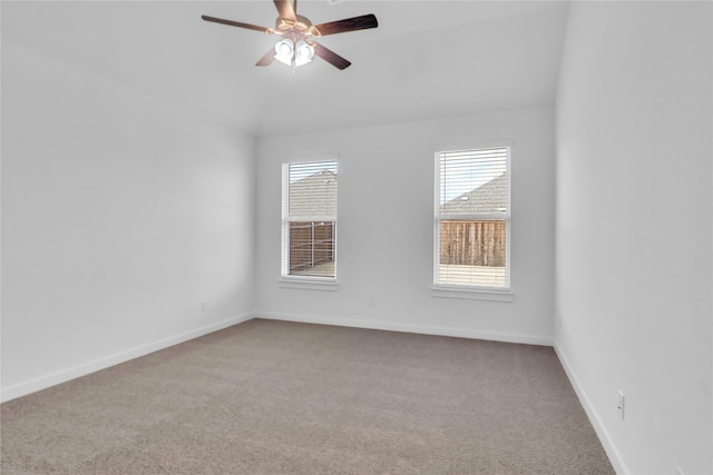 empty room with ceiling fan and light colored carpet