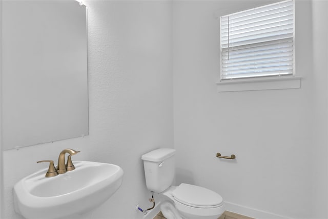 bathroom with sink and toilet