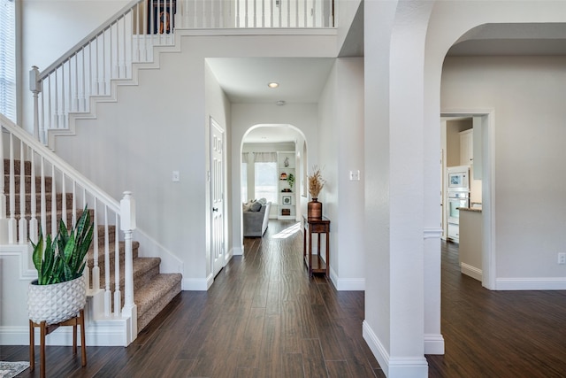 foyer entrance featuring dark hardwood / wood-style floors