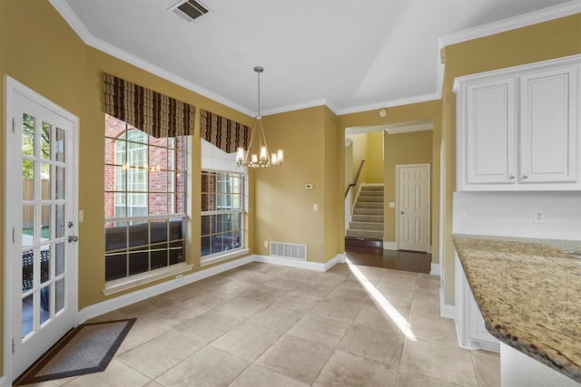 unfurnished dining area featuring a notable chandelier, crown molding, and light tile patterned floors