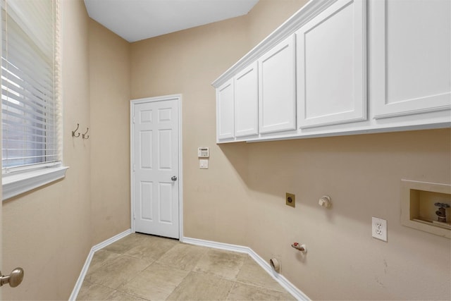 clothes washing area featuring washer hookup, cabinets, hookup for an electric dryer, and gas dryer hookup